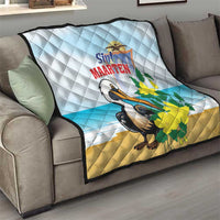 Light blue and tan quilt blanket with diamond stitching, pelican and yellow flower design