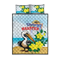 Quilt bed set with pelican design, matching pillows, light-blue quilt with yellow-green flowers