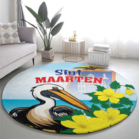 Round blue area rug with large pelican and yellow flowers, Sint Maarten title