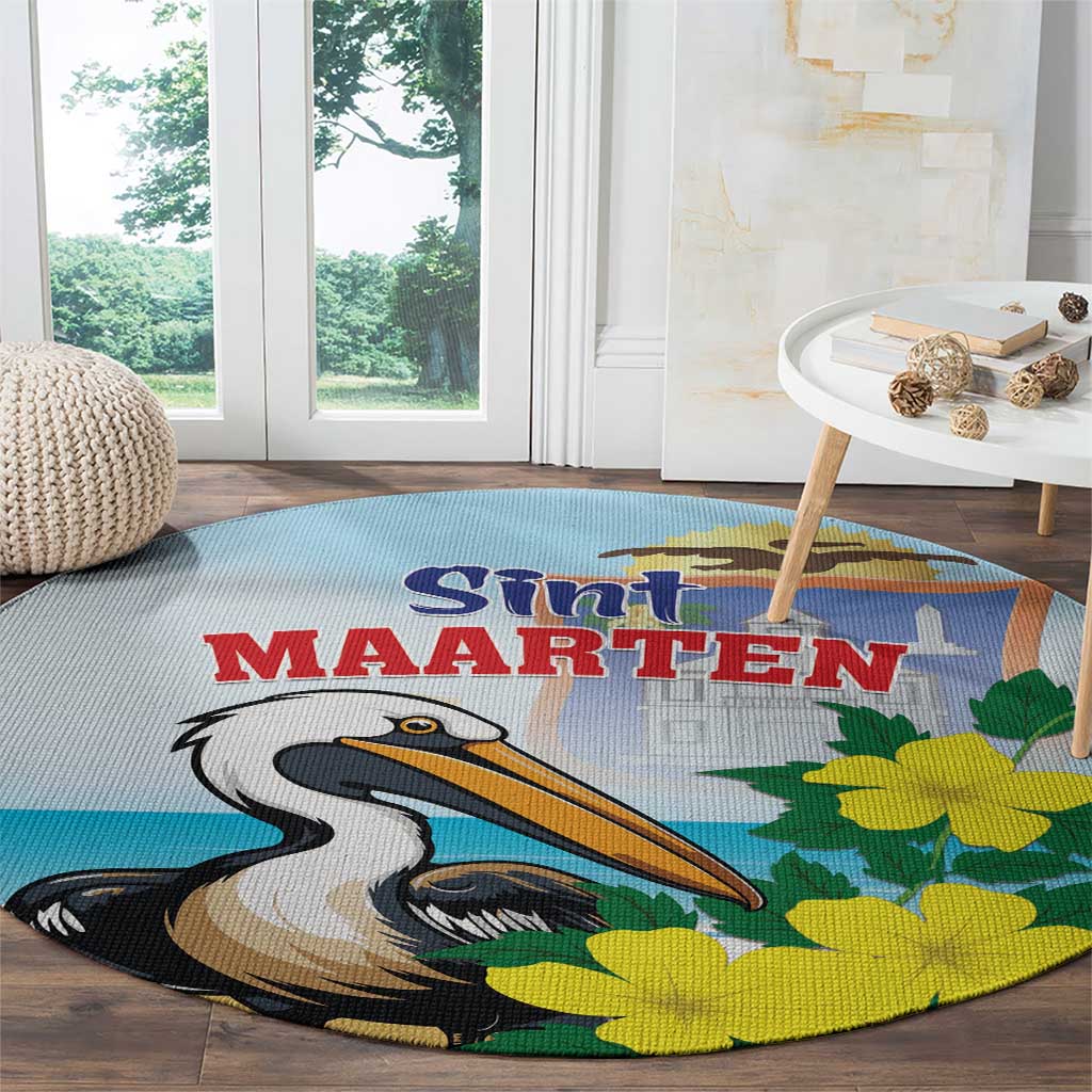 Round blue area rug with pelican artwork and yellow flowers, Sint Maarten lettering
