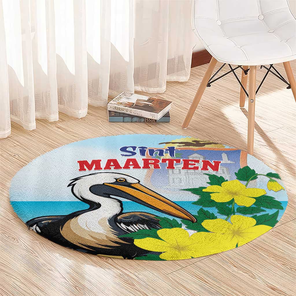 Round blue area rug with pelican and yellow flower print, centered Sint Maarten text