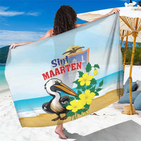 Sint Maarten sarong with pelican and yellow flowers on light blue and tan beach print