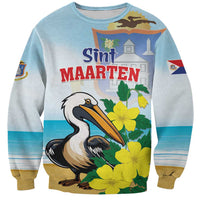 Light blue unisex sweatshirt with front graphic of pelican, Sint Maarten text, flowers