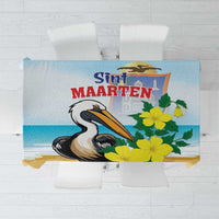 Blue tablecloth with pelican and yellow floral print, rectangular.