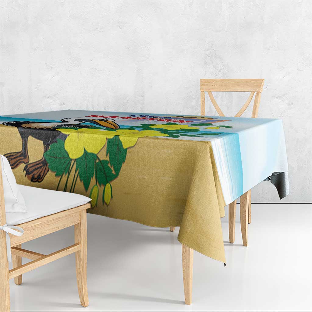 Blue tablecloth with pelican and green leaf pattern, overhanging edge detail.
