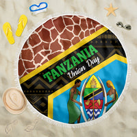 Round fringed beach blanket with Tanzania Union Day graphic and giraffe-style background