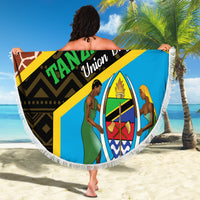 Round fringed beach blanket with Tanzania Union Day print, held open