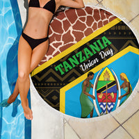Round fringed beach blanket with Tanzania Union Day print, blue and brown giraffe design