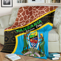 Brown giraffe-print blanket with blue emblem panel and yellow-edged black band