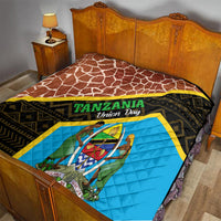Tanzania Union Day quilt on wooden bed, brown giraffe pattern and blue emblem panel