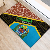 Brown rubber doormat with blue center panel, black stripes, and Tanzania Union Day text