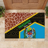 Brown rubber doormat with Tanzania Union Day graphic, black border, and blue corner panel