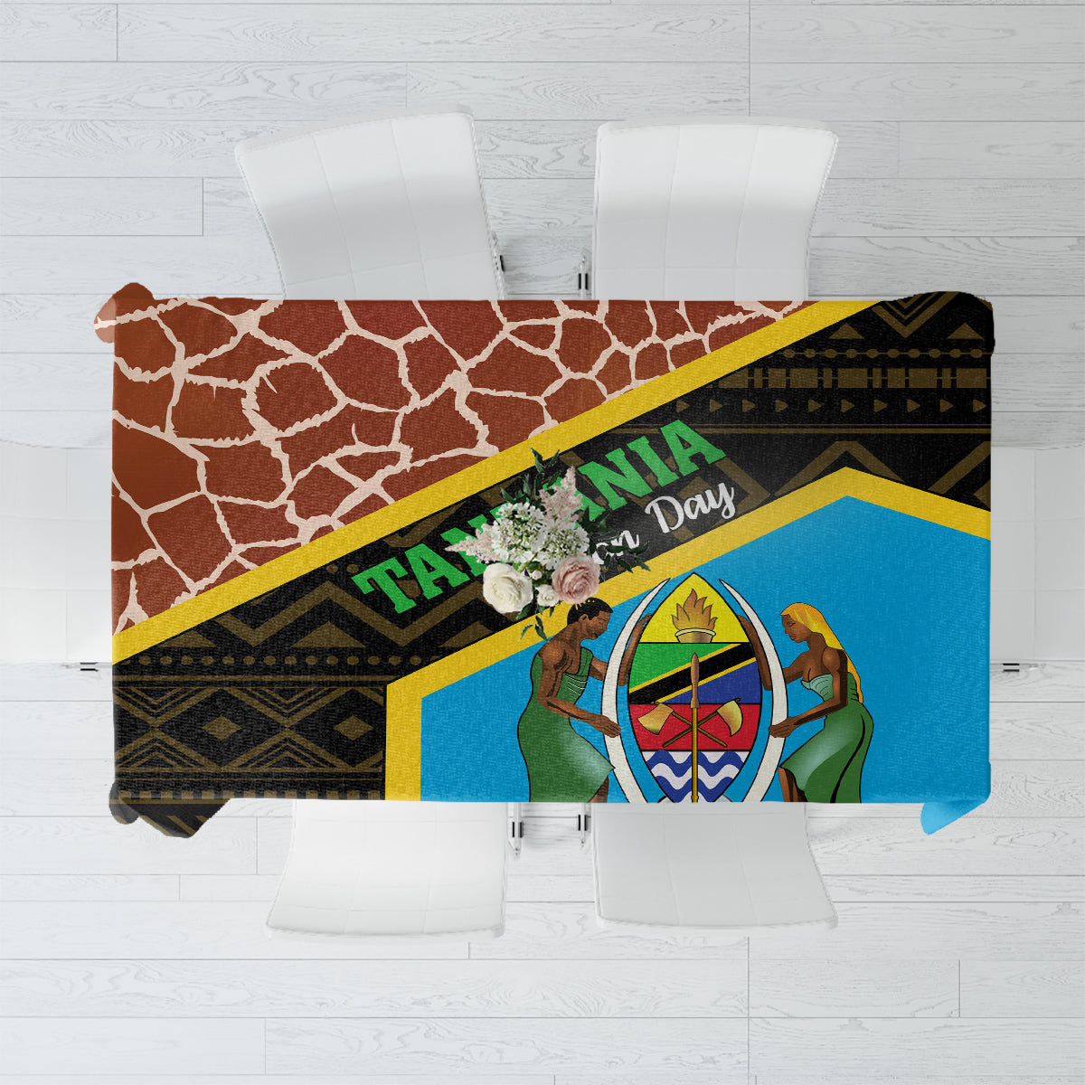 Giraffe-pattern tablecloth with blue centerpiece, yellow trim, and dark brown border