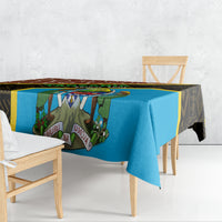 Giraffe-pattern tablecloth draped over round table, blue center panel and dark border