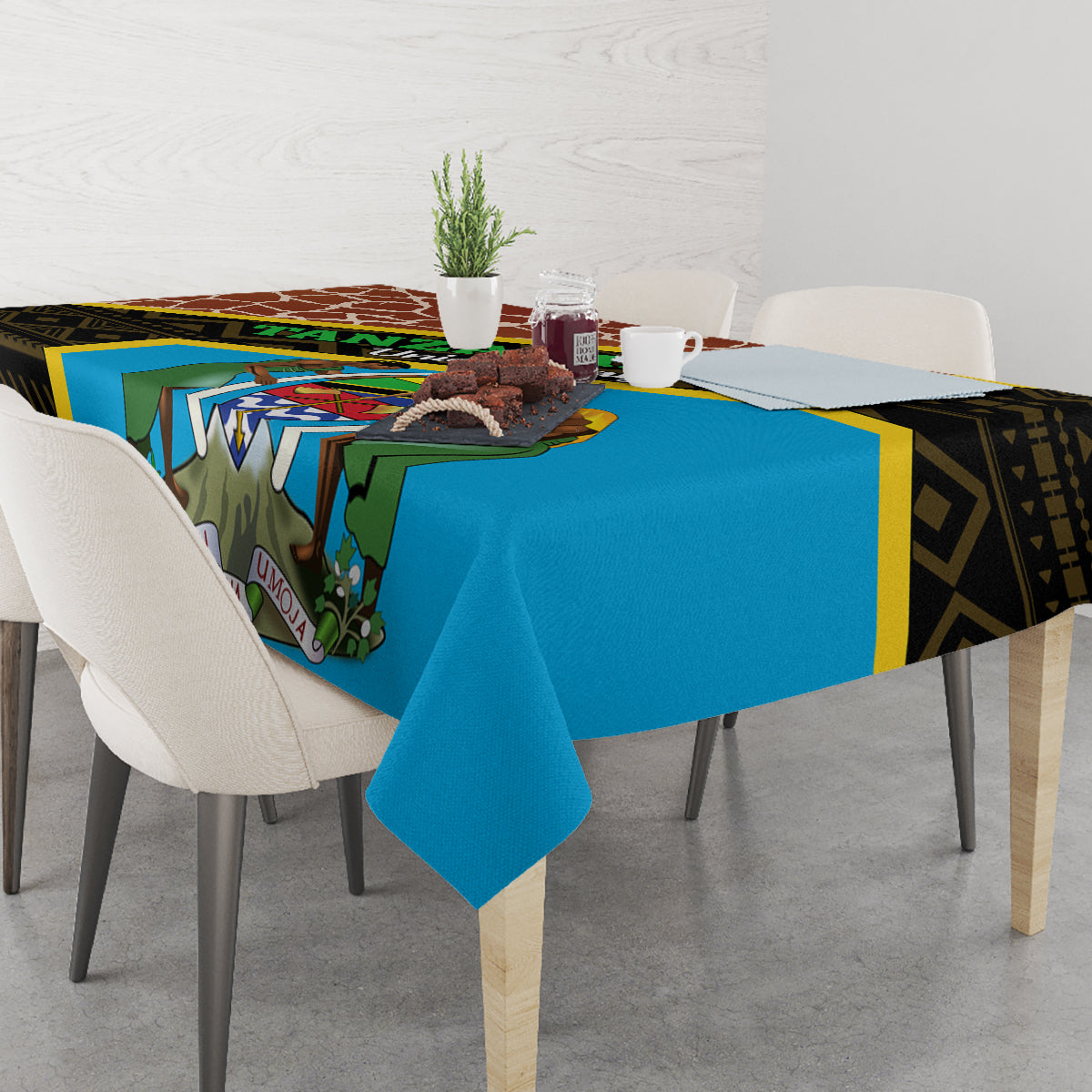 Square tablecloth with blue center panel, giraffe motif, and dark geometric trim