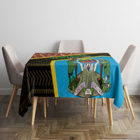 Rectangular tablecloth with blue and black geometric band, yellow edge, giraffe motif
