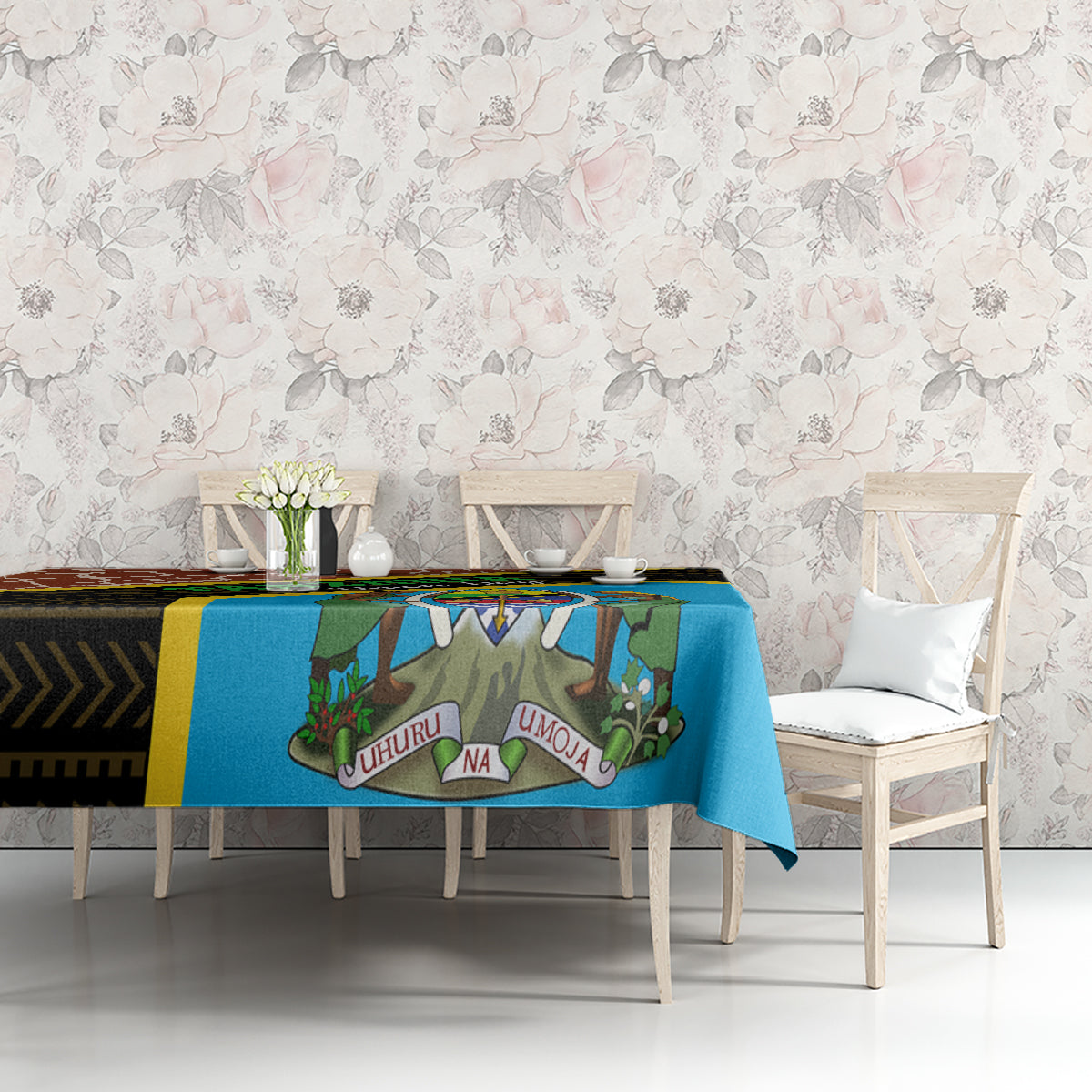 Giraffe-themed tablecloth with blue center, dark geometric band, and yellow edge on table