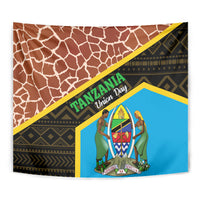 Close-up giraffe-pattern tapestry with blue center emblem and brown mottled border