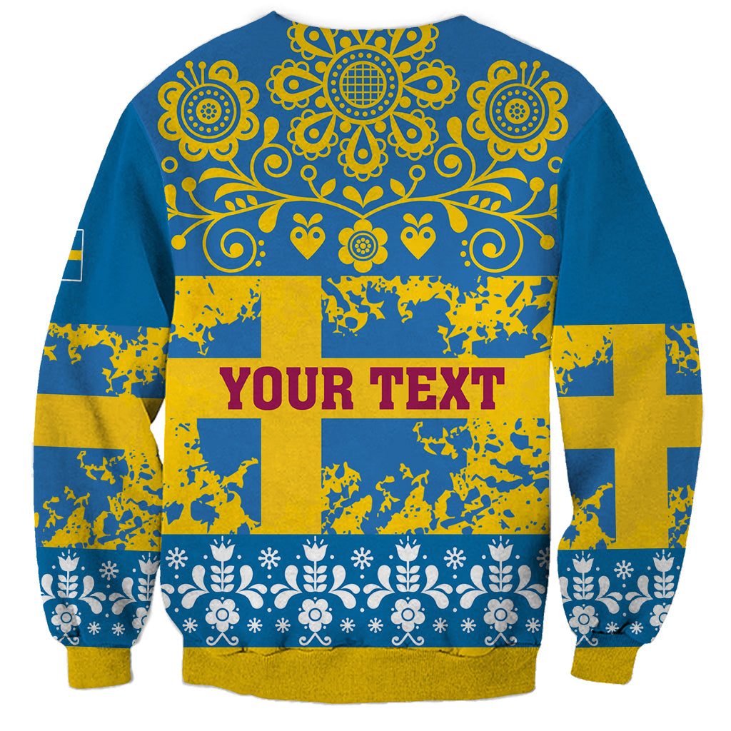 Blue crewneck sweatshirt back with ornate yellow motifs, Swedish-style flags, and YOUR TEXT