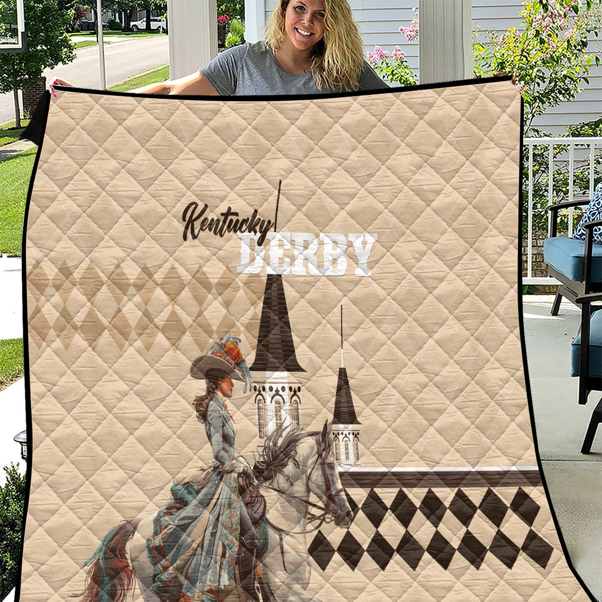 Beige Kentucky Derby quilt with diamond pattern, rider artwork, and black checkered trim