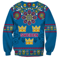 Unisex blue sweatshirt with Sweden text, floral crown icons and decorative border trim
