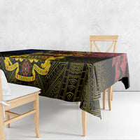 African patterned tablecloth with geometric motifs and red stripe, draped on dining table