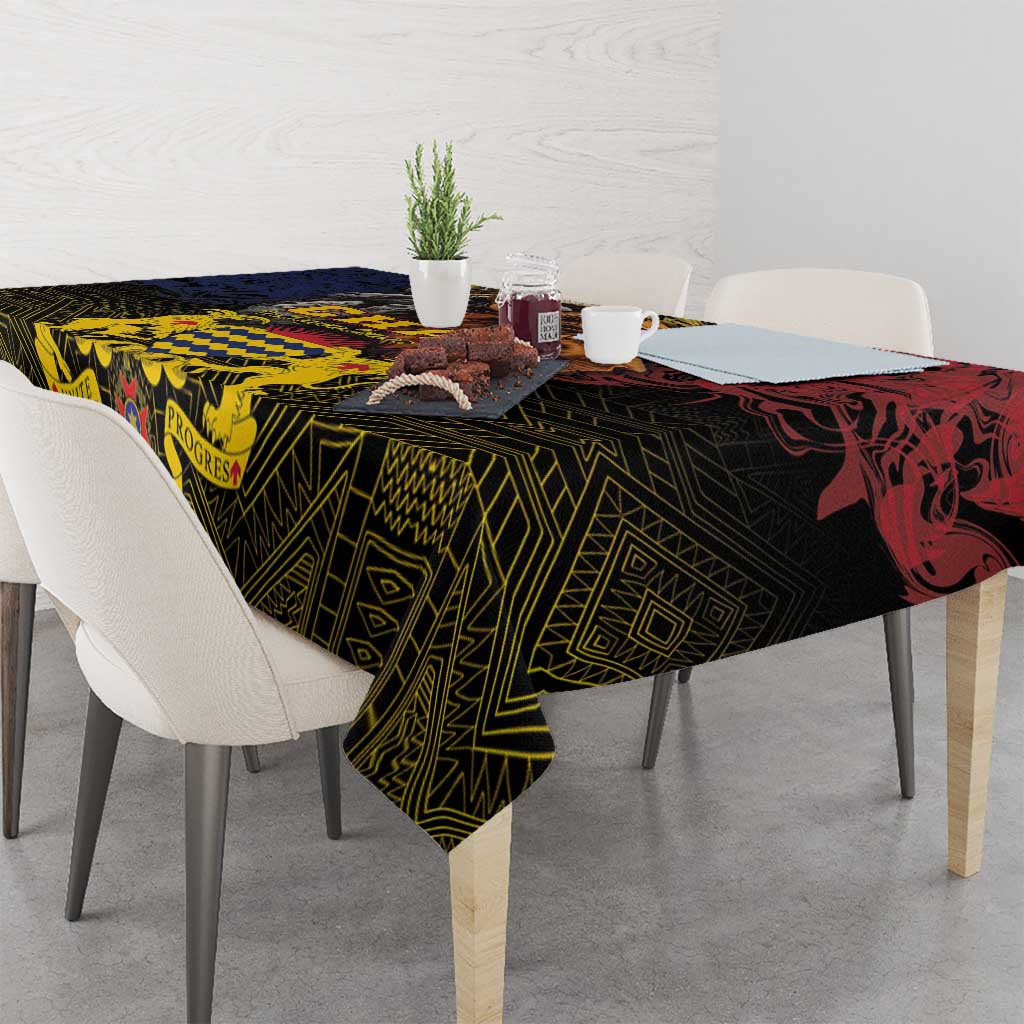 African patterned tablecloth with geometric border, dark green and red accents on dining set