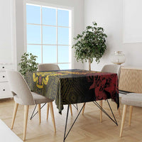 African patterned tablecloth with red lion graphic, dark green and yellow geometric design