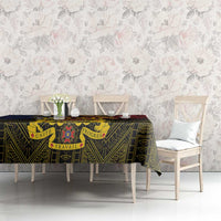African patterned tablecloth with crest motif, dark base with green and red accents