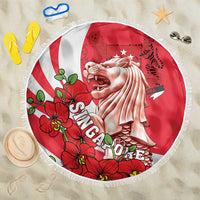 Round red beach blanket with fringe, Merlion graphic and red orchid flowers