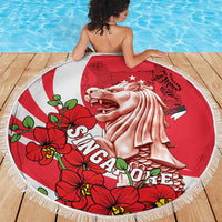 Round red beach blanket with fringe, Merlion and red orchid flowers, on deck