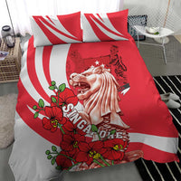 Red and white bedding set with two pillows; merlion illustration with red orchid blossoms