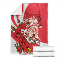 Folded red and white Merlion and floral blanket set, includes matching rolled pieces