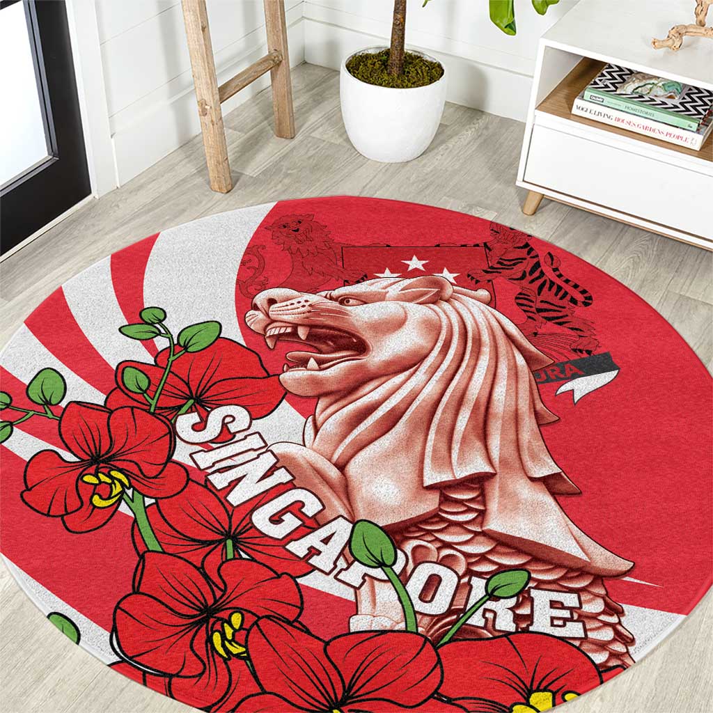 Red round area rug with white merlion graphic and red orchid floral border