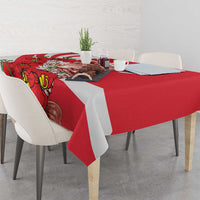 Red tablecloth with white stripe and Merlion face detail, featuring red orchid flowers.