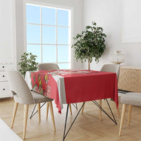 Red tablecloth with bold floral Merlion print and white diagonal panels for dining table.