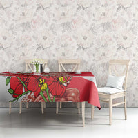 Red tablecloth with white diagonal stripe and Merlion orchid design on dining table.