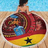 Round beach blanket with fringed border and African woman in blue, red yellow black.