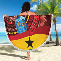 Round beach blanket with fringed edge and star centerpiece, red yellow black pattern.
