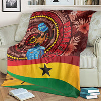 Ghana tropical print blanket on sofa, circular motif with woman figure and yellow star