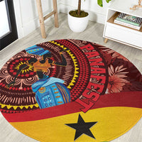 Red round rug with Ghanaian tropical pattern, detailed motifs, and a large yellow star