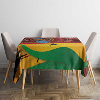 Square red tablecloth with tropical pattern, green and yellow bands, featuring a yellow star.