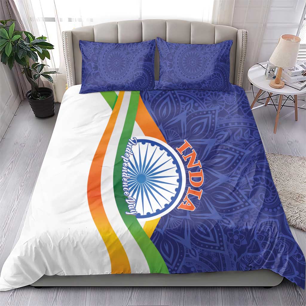 India-themed bedding set on bed: blue paisley duvet with Ashoka emblem and tricolor stripe pillow shams