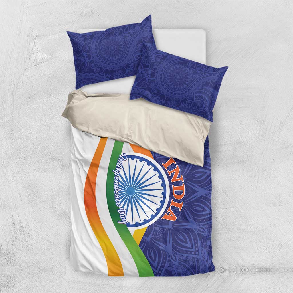 India-themed bedding set laid flat: blue paisley duvet with Ashoka emblem and tricolor stripe, shams