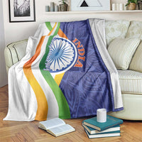 India themed blanket with blue paisley design and multicolor flag-style stripes