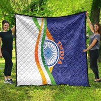 Quilt blanket with diamond quilting, white-blue panels, tricolor band, and circular emblem