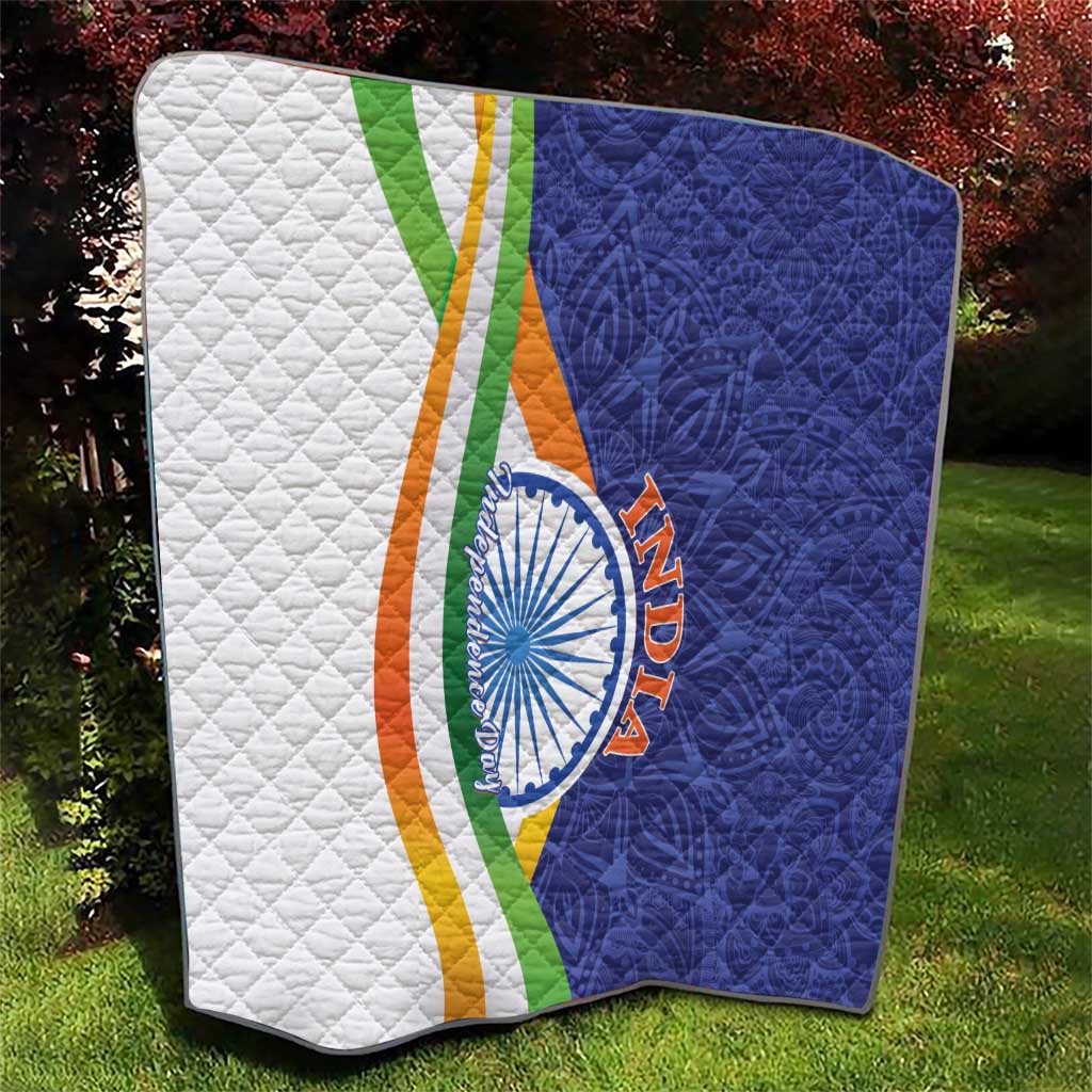 Folded quilt blanket with diamond quilting, white and navy sides, tricolor stripe, emblem
