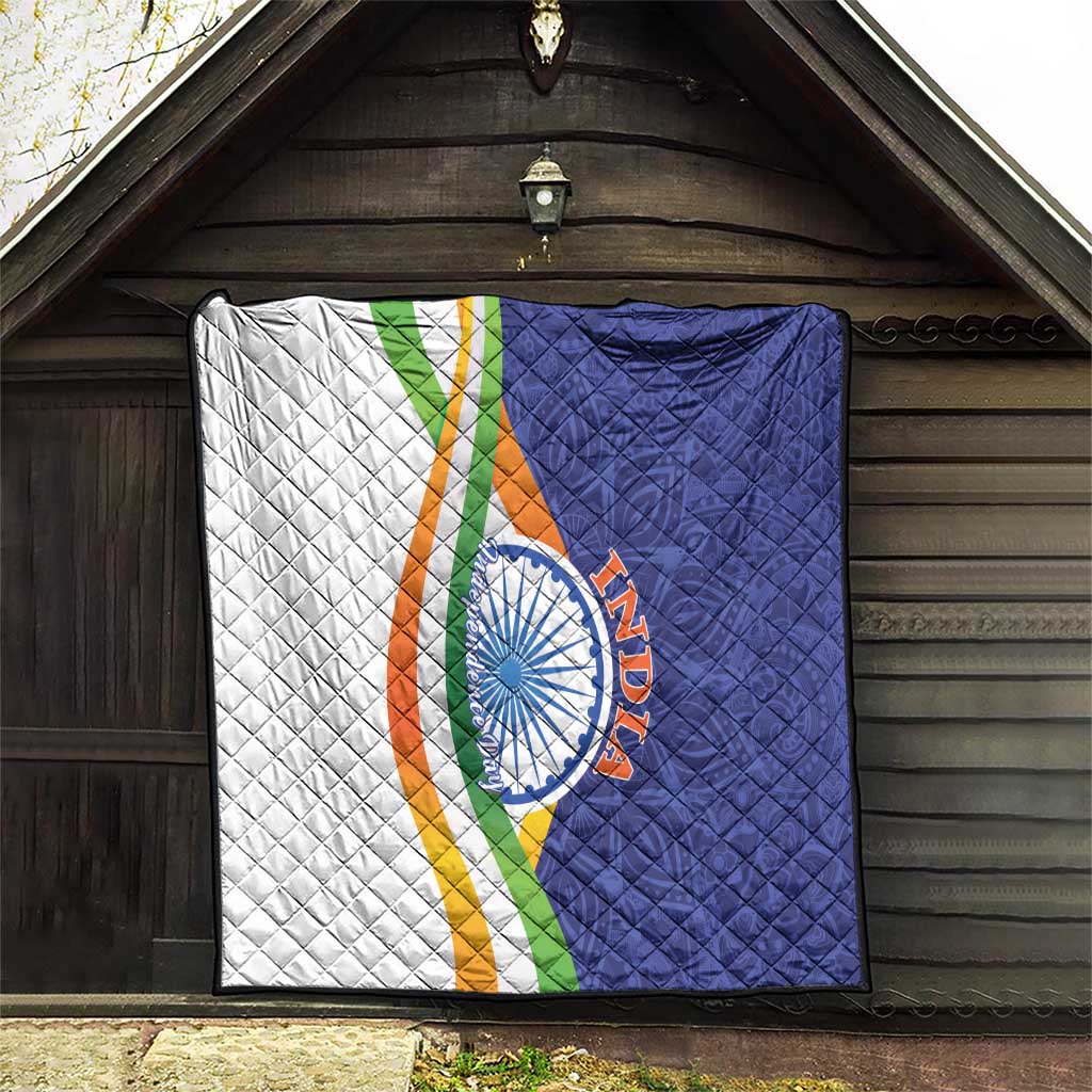 Quilt blanket hung flat, diamond quilting with white panel, navy panel, tricolor stripe, emblem