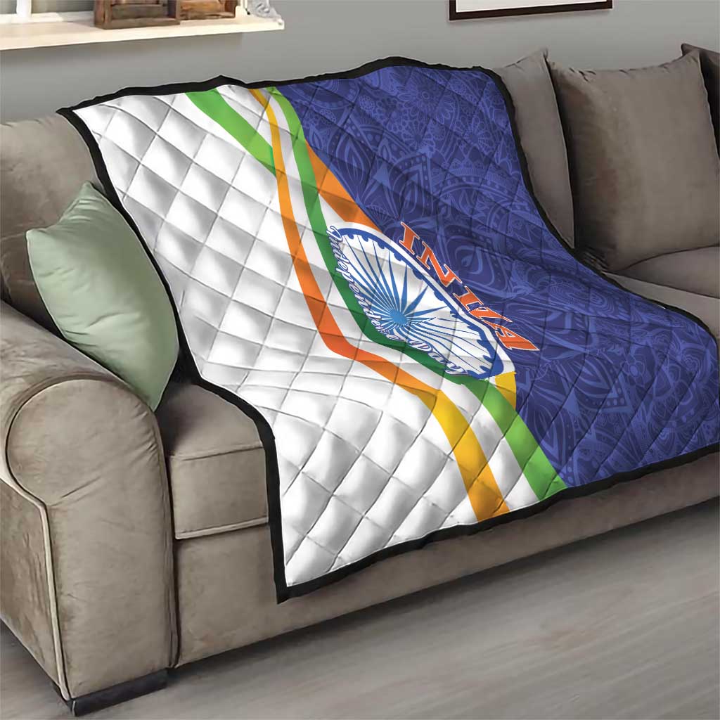 Quilt blanket with diamond quilting and tricolor stripe, white panel and navy panel, emblem
