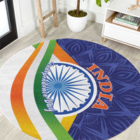 Round mandala carpet, blue paisley with white Ashoka wheel, green/orange stripes, 'AZADI'